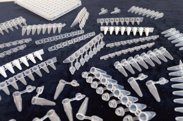 A dispersion of different PCR plastic tubes and strips from different sizes and shapes.